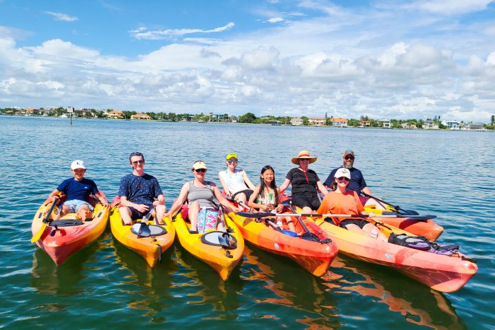 a group of people on a boat in the water