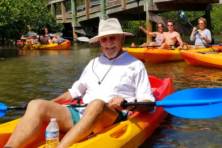 a group of people riding on the back of a boat